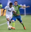 Seattle Sounders' Harry Shipp (19) kicks the ball away from Vancouver Whitecaps' Cristian Techera (13) during the first half of an MLS soccer game in Vancouver, on Saturday September 15, 2018. Former Montreal Impact midfielder Harry Shipp has retired after seven MLS seasons to pursue an MBA at Northwestern University's Kellogg School of Management. THE CANADIAN PRESS/Darryl Dyck