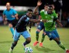 Vancouver Whitecaps forward Cristian Dajome, left, and Seattle Sounders defender Nouhou Tolo compete for a ball during the second half of an MLS soccer match, Sunday, July 19, 2020, in Kissimmee, Fla. The Vancouver Whitecaps have moved into Freddy Krueger mode at the MLS is Back Tournament. After losing to Seattle on Sunday in a 10:30 p.m. ET start, the Whitecaps are changing their schedule ahead of a 9 a.m. kickoff Thursday against Chicago Fire FC at ESPN's Wide World of Sports complex in the Orlando area. THE CANADIAN PRESS/AP, Phelan M. Ebenhack