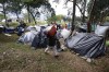 Venezuelan migrants camp in a park near the main bus terminal in Bogota, Colombia, Friday, Sept. 7, 2018. Canada vanquished its two rivals for the United Nations Security Council at Tuesday's international pledging conference to help South American countries coping with the Venezuelan refugee crisis and COVID-19. THE CANADIAN PRESS/AP, Fernando Vergara