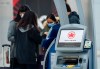 People check in at an Air Canada ticketing kiosk at Pearson International Airport in Toronto on Wednesday, April 8, 2020. Air Canada is hoping to raise more than $1 billion in share offerings and debt as the company struggles to bolster liquidity amid the financial devastation of the COVID-19 pandemic. THE CANADIAN PRESS/Nathan Denette