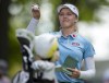 Brooke Henderson, of Smith's Falls, Ont., shows her playing partner her ball marking on the first tee during the third round of the CP Women's Open in Aurora, Ont., Saturday, Aug. 24, 2019. After the longest layoff of her career, Brooke Henderson is back in action at this week's Women's British Open. THE CANADIAN PRESS/Frank Gunn