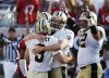 New Orleans Saints kicker John Carney (3) is congratulated by holder Mitch Berger, centre, and Jerry Fontenot, right, after kicking the game-winning field goal in the final seconds of the game Sunday, Nov. 2, 2003, in Tampa, Fla. Mitch Berger can feel the Toronto Blue Jays' pain. The Blue Jays are playing most of their 30 home games this season in Buffalo, N.Y., after the Canadian government rejected their plan to use Rogers Centre. THE CANADIAN PRESS/AP, Scott Martin