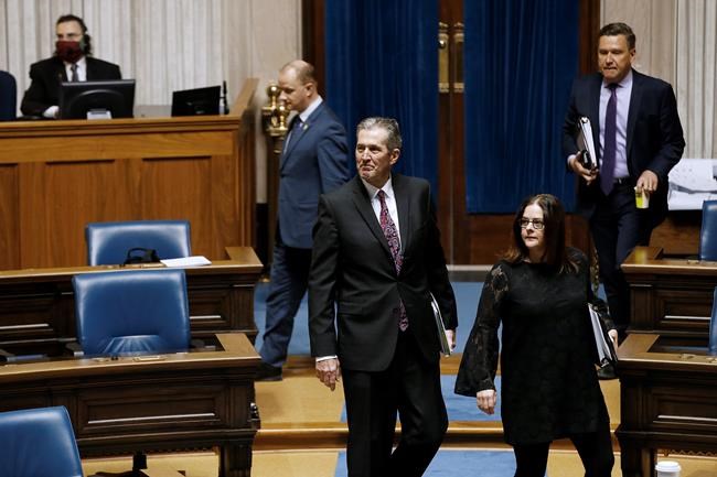 Manitoba Premier Brian Pallister enters an emergency COVID-19 physically distanced session at the Manitoba Legislature in Winnipeg, Wednesday, April 15, 2020. THE CANADIAN PRESS/John Woods