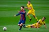 Barcelona's Lionel Messi, left, controls the ball during the Spanish La Liga soccer match between FC Barcelona and Cadiz at the Camp Nou stadium in Barcelona, Spain, Sunday, Feb. 21, 2021. (AP Photo/Joan Monfort)