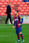 Barcelona's head coach Ronald Koeman watches the Spanish La Liga soccer match between FC Barcelona and Cadiz at the Camp Nou stadium in Barcelona, Spain, Sunday, Feb. 21, 2021. (AP Photo/Joan Monfort)