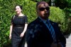 A security guard looks on as Meng Wanzhou, chief financial officer of Huawei, leaves her home to go to B.C. Supreme Court in Vancouver, Wednesday, May 27, 2020. THE CANADIAN PRESS/Jonathan Hayward