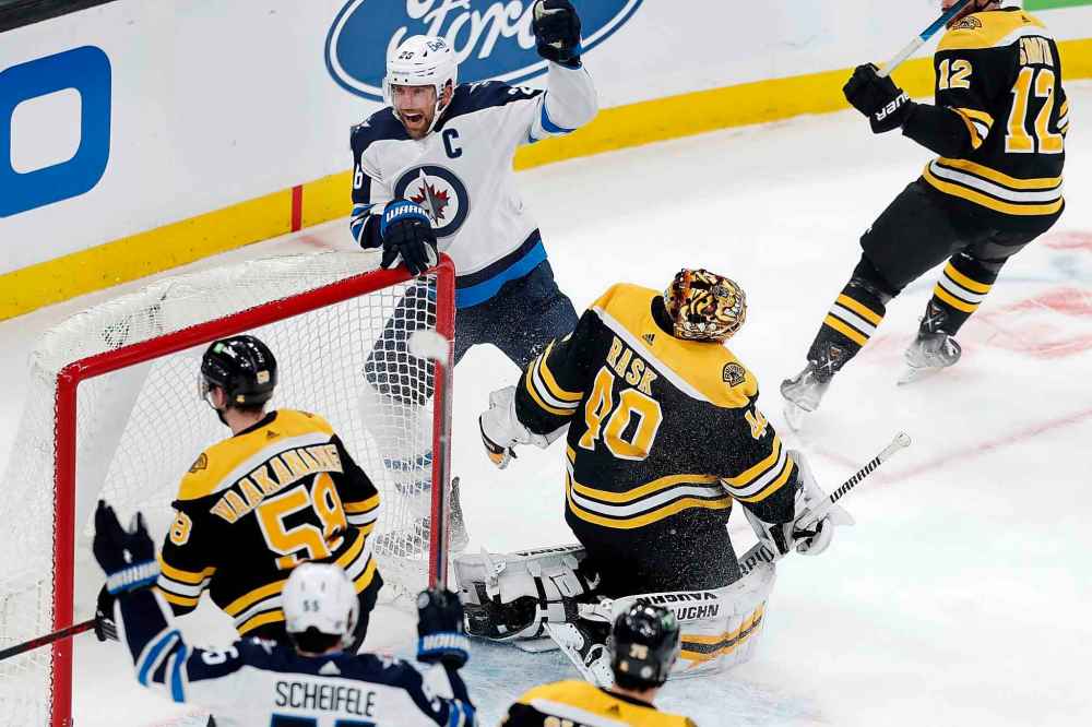 CP
Winnipeg Jets' Blake Wheeler celebrates the goal by Andrew Copp on Boston Bruins' Tuukka Rask during the first period . (Michael Dwyer / The Associated Press)