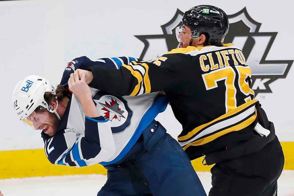 CP
Boston Bruins' Connor Clifton and Winnipeg Jets' Jansen Harkins fight during the first period. (Michael Dwyer / The Associated Press)