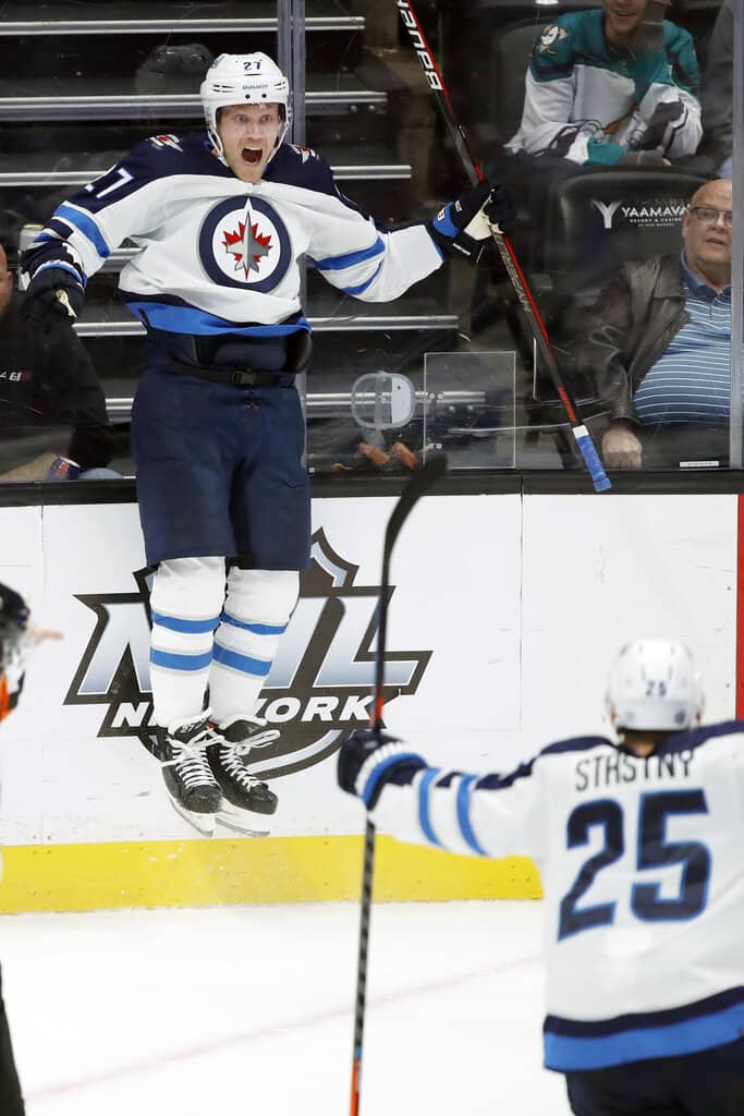 CP
Winnipeg Jets left wing Nikolaj Ehlers, left, leaps to celebrate his goal with center Paul Stastny against the Anaheim Ducks during the third period.(AP Photo/Alex Gallardo)