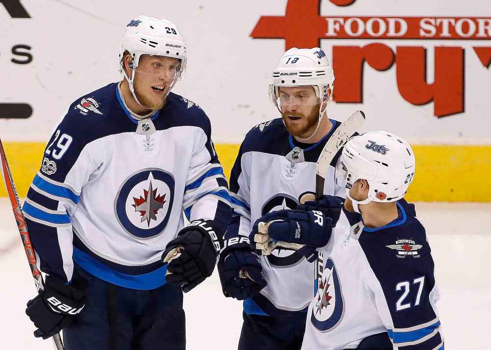 CP
Former Winnipeg Jets right winger Patrik Laine, left, was on a line with Bryan Little and Nikolaj Ehlers in 2017. (AP Photo/Ross D. Franklin)