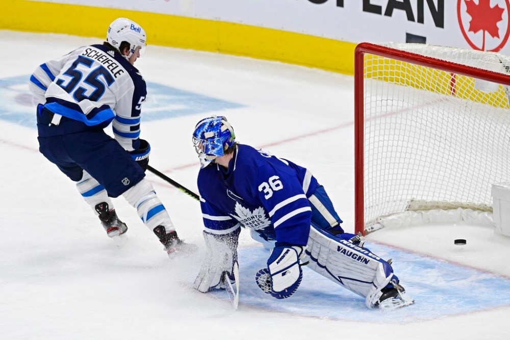 CP
Winnipeg Jets' Mark Scheifele scores on Toronto Maple Leafs' goaltender Jack Campbell during the first period. THE CANADIAN PRESS/Frank Gunn