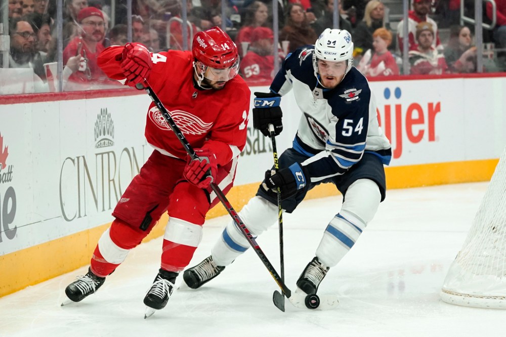 (AP Photo/Paul Sancya)
Winnipeg Jets' Dylan Samberg defends against Detroit Red Wings' Robby Fabbri in the second period.