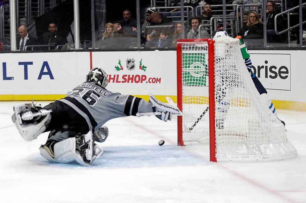 CP
Jack Roslovic gets the Jets on the score sheet in the third, putting the puck past Kings' goaltender Jack Campbell after a pass from Tucker Poolman. (Marcio Jose Sanchez / The Associated Press)