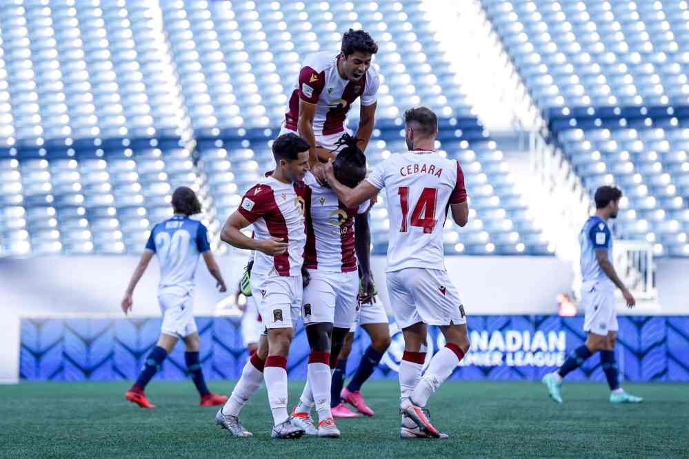 Valour defender Andrew Jean-Baptiste is swarmed by teammates after scoring a first half goal off a header. (Robert Reyes Ong)