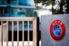 The UEFA logo displayed to the entrance of the UEFA Headquarters, in Nyon, Switzerland, Tuesday, March 17, 2020. The UEFA meet on 17 March 2020 to discuss the effects of the coronavirus pandemic on the UEFA EURO 2020 and the European Cup competitions. For most people, the new coronavirus causes only mild or moderate symptoms, such as fever and cough. For some, especially older adults and people with existing health problems, it can cause more severe illness, including pneumonia. (Jean-Christophe Bott/Keystone via AP)