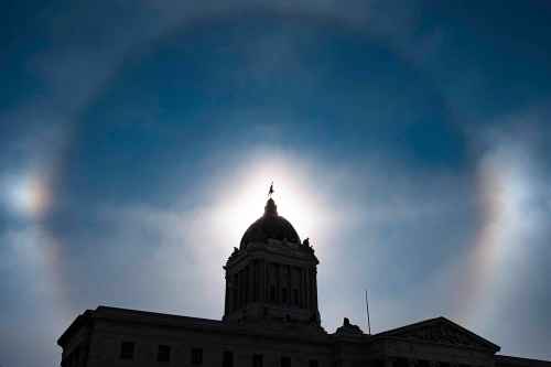 Daniel Crump / Winnipeg Free Press FIles
Daniel Crump / Winnipeg Free Press. A sundog frames the golden boy atop the Manitoba Legislature Saturday afternoon. Temperatures across Manitoba are well below zero as the province is gripped by a polar vortex. February 6, 2021.
