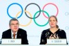 International Olympic Committee (IOC) president Thomas Bach, left, and IOC member and former swimmer Kirsty Coventry, right, speak during a press conference after the executive board meeting of the IOC, at the Olympic House, in Lausanne, Switzerland, Thursday, Jan. 9, 2020. (Laurent Gillieron/Keystone via AP)