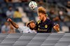 CORRECTS TO NASHVILLE SC'S WALKER ZIMMERMAN NOT RANDALL LEAL - Nashville SC's Walker Zimmerman, right, heads the ball over Sporting Kansas City forward Gianluca Busio, left, during the first half of an MLS soccer match in Kansas City, Kan., Sunday, Oct. 11, 2020. (AP Photo/Orlin Wagner)