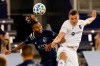 Sporting Kansas City defender Amadou Dia, left, heads the ball next to Chicago Fire defender Boris Sekulic during the first half of an MLS soccer match in Kansas City, Kan., Wednesday, Oct. 7, 2020. (AP Photo/Orlin Wagner)