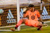 Minnesota United goalkeeper Dayne St. Clair defends the post during the first half of an MLS soccer match against Sporting Kansas City in Kansas City, Kan., Sunday, Sept. 13, 2020. (AP Photo/Orlin Wagner)