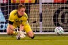 Sporting Kansas City goalkeeper Tim Melia makes a save during the first half of the team's MLS soccer match against the Houston Dynamo in Kansas City, Kan., Tuesday, Aug. 25, 2020. (AP Photo/Orlin Wagner)