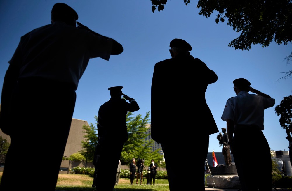 CP
Korean War veterans along with Lt.Gen. Wayne Eyre, Commander of the Canadian Army, salute, second from left, during a ceremony commemorating the 70th anniversary of the Korean War at the Monument to the Canadian Fallen in Ottawa, on Sunday, June 21, 2020. THE CANADIAN PRESS/Justin Tang