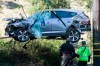 FILE - In this Feb. 23, 2021, file photo a crane is used to lift a vehicle following a rollover accident involving golfer Tiger Woods, in the Rancho Palos Verdes suburb of Los Angeles. The Los Angeles County sheriff says detectives have determined what caused Woods to crash his SUV last month in Southern California but would not release details on Wednesday, March 31, 2021, citing privacy concerns for the golf star. (AP Photo/Ringo H.W. Chiu, File)