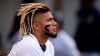 FILE - In this Aug. 10, 2019, file photo, San Diego Padres' Fernando Tatis Jr. looks on from the dugout during the fifth inning of A baseball game against the Colorado Rockies in San Diego. Tatis Jr. has become one of major league baseball's most exciting young players, showing an instinct and aggressiveness that make it hard to believe he's only 20. (AP Photo/Orlando Ramirez, File)