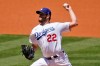 Los Angeles Dodgers starting pitcher Clayton Kershaw throws to the Cincinnati Reds during the first inning of a baseball game Wednesday, April 28, 2021, in Los Angeles. (AP Photo/Marcio Jose Sanchez)