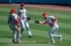 Los Angeles Angels first baseman Jared Walsh, right, cannot catch a fly ball off the bat of Los Angeles Dodgers' Justin Turner during the third inning of a baseball game in Los Angeles, Sunday, Sept. 27, 2020. (AP Photo/Kyusung Gong)