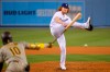 Los Angeles Dodgers starting pitcher Dustin May, right, tires to catch a comeback shot hit by San Diego Padres' Jurickson Profar as Profar grounds out during the fifth inning of a baseball game Monday, Aug. 10, 2020, in Los Angeles. (AP Photo/Mark J. Terrill)