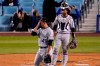 Colorado Rockies starting pitcher Antonio Senzatela, left, wipes his face as catcher Elias Diaz watches after Los Angeles Dodgers' Corey Seager scored on a single by Gavin Lux during the third inning of a baseball game Tuesday, April 13, 2021, in Los Angeles. (AP Photo/Mark J. Terrill)