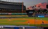 The Los Angeles Dodgers play the Los Angeles Angels at sunset during the fifth inning of a preseason baseball game, Tuesday, July 21, 2020, in Los Angeles. (AP Photo/Mark J. Terrill)