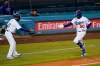 Los Angeles Dodgers' Mookie Betts, right, keeps distance as he celebrates his second home run of a baseball game with third base coach Dino Ebel during the fourth inning against the San Diego Padres, Thursday, Aug. 13, 2020, in Los Angeles. (AP Photo/Jae C. Hong)