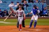 Washington Nationals' Andrew Stevenson, left, tosses his bat after striking out to end the sixth inning of a baseball game as Los Angeles Dodgers catcher Will Smith throws the ball Saturday, April 10, 2021, in Los Angeles. (AP Photo/Mark J. Terrill)