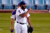 Los Angeles Dodgers relief pitcher Kenley Jansen, right, gestures as catcher Austin Barnes looks on after the Dodgers defeated the Colorado Rockies 4-2 in a baseball game Wednesday, April 14, 2021, in Los Angeles. (AP Photo/Mark J. Terrill)