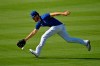 Los Angeles Dodgers center fielder Cody Bellinger fields a ball during the restart of baseball spring training Friday, July 3, 2020, in Los Angeles. (AP Photo/Mark J. Terrill)