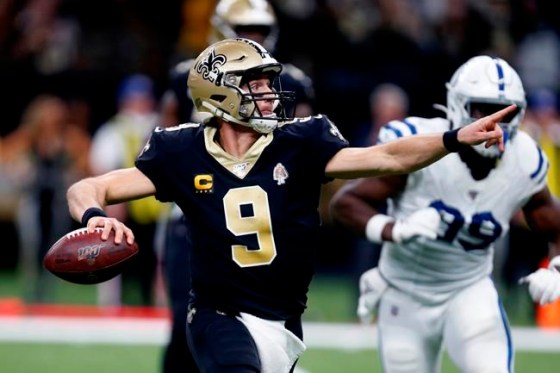 New Orleans Saints quarterback Drew Brees (9) scrambles to pass in the first half of an NFL football game against the Indianapolis Colts in New Orleans, Monday, Dec. 16, 2019. Brees set the all-time NFL completion percentage in a game completing 28 of 29 passes for a completion percentage of 96.7. (AP Photo/Butch Dill)