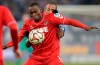 FILE - In this Saturday, Dec. 13, 2014 file photo, Cologne's Anthony Ujah from Nigeria, front, and Schalke's Dennis Aogo challenge for the ball during the German Bundesliga soccer match between FC Schalke 04 and 1. FC Cologne in Gelsenkirchen, Germany. Union Berlin striker Anthony Ujah has encouraged his fellow German soccer league players to be more proactive in the fight against racism. Ujah was the first Bundesliga player to react on social media to the killing of George Floyd, a handcuffed black man, who died on May 25 after a white Minneapolis police officer pressed his knee for several minutes on his neck. (AP Photo/Martin Meissner, File)