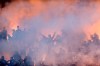 FILE - In this Thursday, May 23, 2019 file photo, Partizan Belgrade fans light flares and smoke bombs as they cheer on their team on during the Serbian Cup Final soccer fixture against Red Star Belgrade in Belgrade, Serbia. Red Star Belgrade can host the biggest crowd for a game in Europe since soccer’s shutdown in the pandemic ended last month when the Serbian title winner completes its season on June 20, 2020. Another big crowd is expected Wednesday June 10, 2020 in a passionate atmosphere now rarely seen in Europe. Partizan hosts city rival Red Star in the domestic cup semi-finals at its 30,000-capacity home. (AP Photo/Marko Drobnjakovic, File)