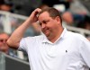 FILE - In this Sunday, Aug. 9, 2015 file photo, Newcastle United's owner Mike Ashley looks on from the stands during their English Premier League soccer match between Newcastle United and Southampton at St James' Park, Newcastle, England. After so many false dawns and collapsed takeover talks, Newcastle could finally have a new owner by the time the Premier League resumes. The end of the Ashley era will not be lamented by those Newcastle supporters who have grown frustrated with the club's failure to win a domestic trophy since 1955. (AP Photo/Scott Heppell, File)