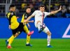 FILE - In this Tuesday, Feb. 18, 2020 file photo, Dortmund's Jadon Sancho, left, and PSG's Thomas Meunier duels for the ball during the Champions League round of 16 first leg soccer match between Borussia Dortmund and Paris Saint Germain in Dortmund, Germany. Borussia Dortmund signed right back Thomas Meunier from Paris Saint-Germain on Thursday June 25, 2020. (AP Photo/Martin Meissner, File)