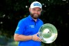 England's Andy Sullivan celebrates winning the English Championship on day four of the English Championship at Hanbury Manor Marriott Hotel and Country Club, Ware, England,. Sunday Aug. 9, 2020. (Adam Davy/PA via AP)