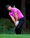 Patrick Reed of the US chips onto the fourth green during day one of the PGA Championship at Wentworth Club, Virginia Water, England, Thursday Oct. 8, 2020. (Adam Davy/PA via AP)