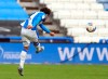 Huddersfield Town's Duane Holmes scores their side's fourth goal of the game during the Championship match at John Smith's Stadium, Huddersfield, England, Saturday Feb. 20, 2021. (Mike Egerton/PA via AP)