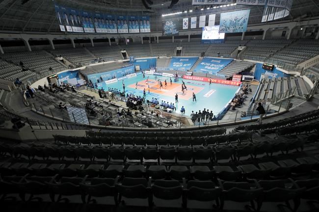 Stadium seats are empty during the pro volleyball V-league between the Wooricard Wibee and Hyundai Capital Services Skywalkers in Seoul, South Korea, Thursday, Feb. 27, 2020. The volleyball game held without spectators to prevent the spread of the COVID-19. (AP Photo/Lee Jin-man)
