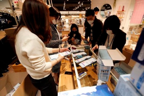 Lee Jin-man / The Associated PressEmployees of a department store prepare to sell face masks at a department store in Seoul, South Korea, Friday, Feb. 28, 2020. Countries take harsh containment steps as a new virus spreads. (AP Photo/Lee Jin-man)
