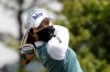 Choi Ye-rim of South Korea wearing a face mask watches her tee shot on the first hole during the first round of the 42nd KLPGA Championship golf at the Lakewood Country Club in Yangju, South Korea, Thursday, May 14, 2020. (AP Photo/Lee Jin-man)