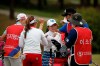 Lee Bo-mee of South Korea, center, reacts on the 18th hole after finishing the first round of the 42nd KLPGA Championship golf at the Lakewood Country Club in Yangju, South Korea, Thursday, May 14, 2020. (AP Photo/Lee Jin-man)