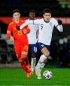 United States' Gio Reyna, right, vies for the ball with Wales' Dylan Levitt during the international friendly soccer match between Wales and USA at Liberty stadium in Swansea, Wales Thursday, Nov. 12, 2020. (AP Photo/Kirsty Wigglesworth)